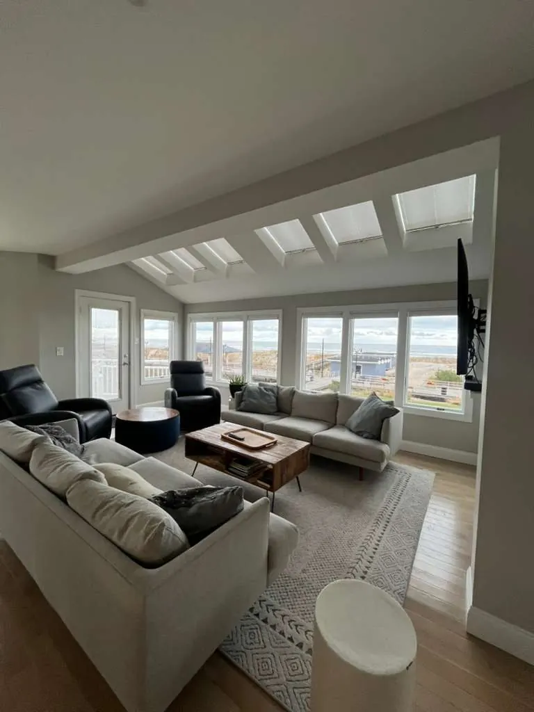 Finished coastal living room with clean interior painting and ocean views